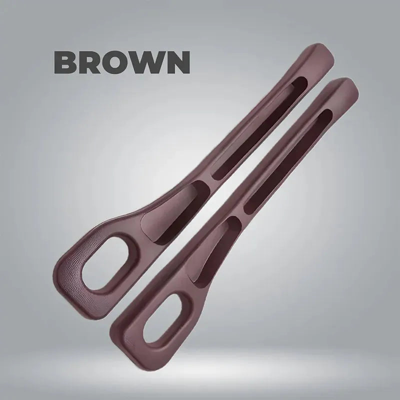 Pair of brown car seat gap fillers on a gray background.